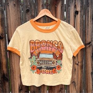 Ford Bronco Yellow and Orange Desert Graphic Crop Ringer Tshirt, Women’s Medium